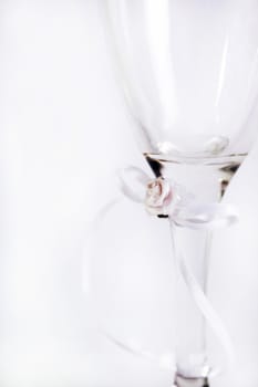 wedding glass isolated against a background. glass does have a ribbon bow tied around it