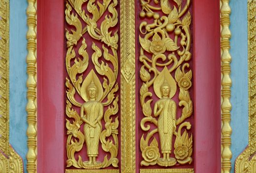 Door woodcarving in temple, Thailand