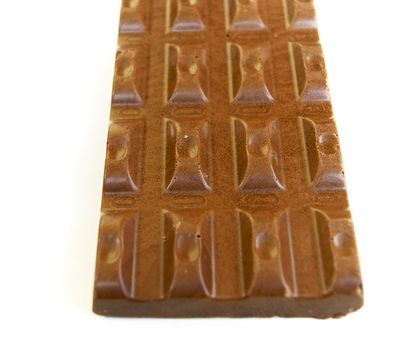 Bar of chocolate on white background is insulated