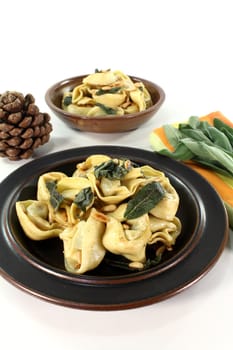 fresh stuffed rocket-ricotta tortellini with sage butter and pine nuts