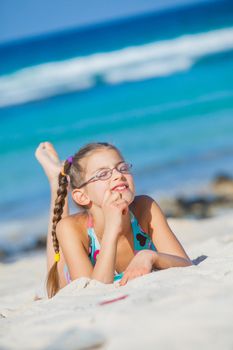Adorable beautiful girl having fun on the tropical beach. Vertical view