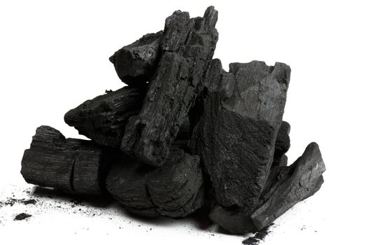 Bits of charcoal prepared to burn isolated on white 