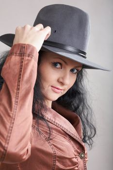 An image of a beautiful girl in felt hat