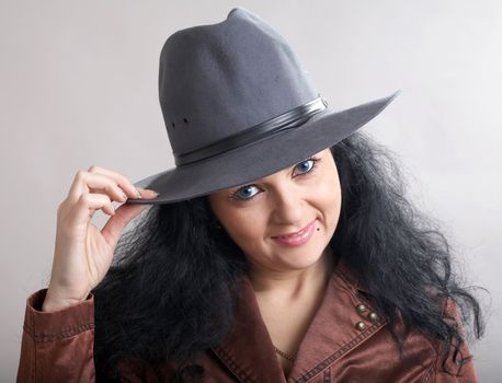 An image of a beautiful woman in felt hat