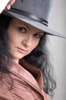 An image of a woman in felt hat