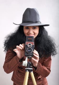 An image of nice photographer-woman in studio