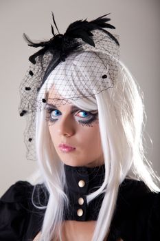 Gothic girl with creative make-up, studio shot 