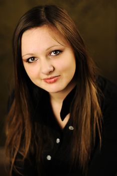 A portrait of young nice girl in studio