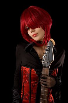 Sensual girl with guitar, isolated on black background 	