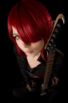 Rock girl with guitar, selective focus, high angle view 