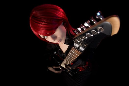 Sexy rock girl with guitar, focus on face, high angle view 