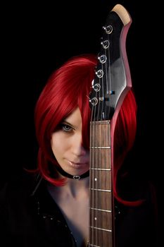 Gothic girl with guitar, isolated on black background  