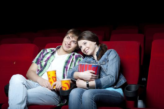 couple in a movie theater, watching a movie