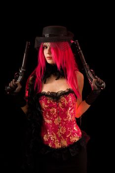 Cabaret girl in pink corset with two guns, isolated on black background 