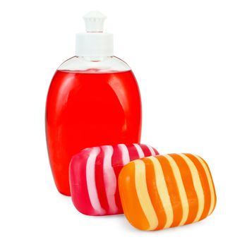 Red liquid soap in a bottle, solid red and orange striped soap isolated on white background