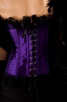 Close-up shot of deep purple corset  