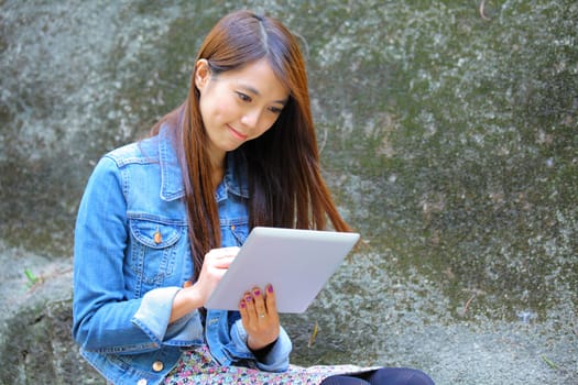 beautiful asian woman using tablet computer