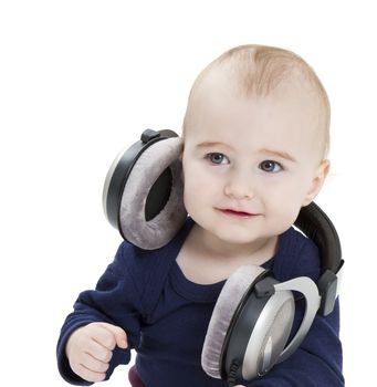 young child with earphones listening to music. isolated on white background