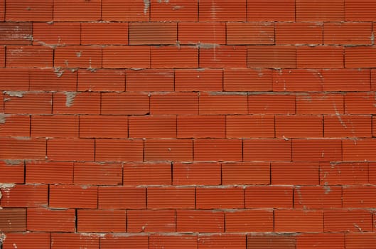 Red new bricks non-plastered wall as background