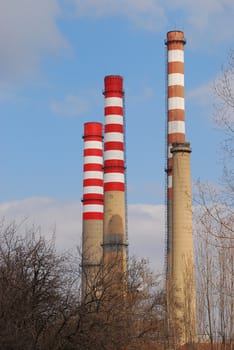 Four painted thermoelectric power plant’s high chimneys