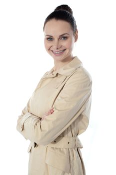 Fashionable glamor lady, smiling. Posing with folded arms