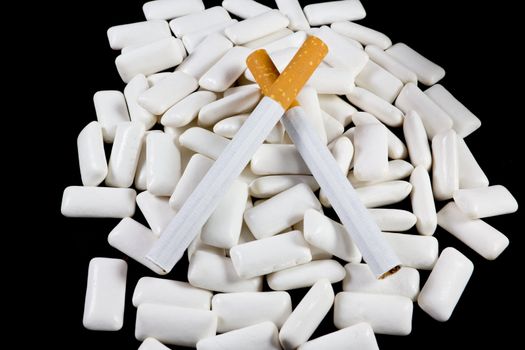 Picture of a bunch of nicotin gums with some cigarettes on