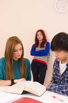 Leaning against the classroom wall and feeling jealous