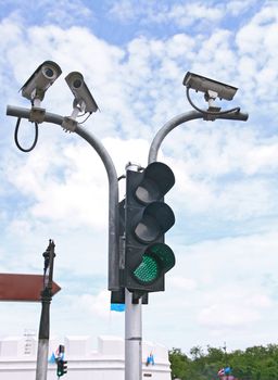 Surveillance Security Camera or CCTV with traffic light