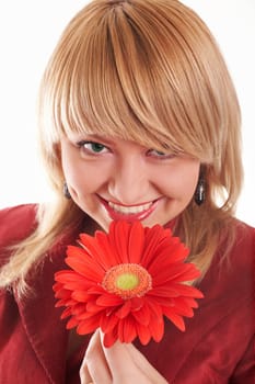 An image of smiling girl with red flower