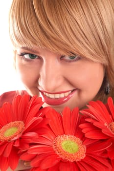 A smiling blonde with red flowers