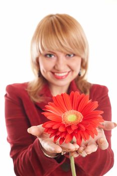 An image of  smiling girl with red flowers