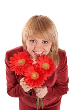 A smiling green-eyed woman with red flowers