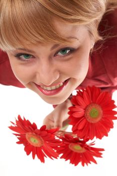 A smiling girl with flowers looking up