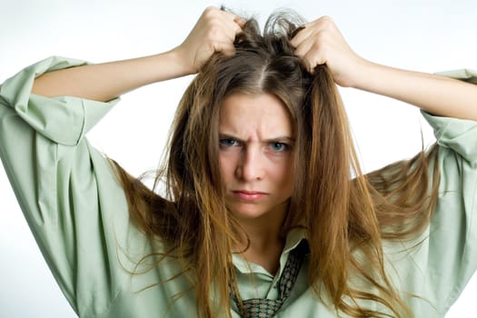 An image of an angry girl tearing her hair