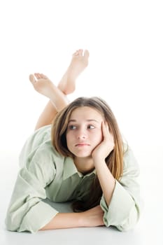 An image of a beautiful young girl lying on the floor