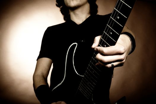 An image of a young man with guitar