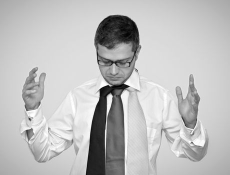 Young businessman choosing a tie