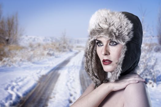 cold winter woman over snowed desolated background