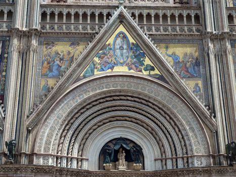 Main west portal  and  the Assumption of Mary - Orvieto Cathedral . Orvieto,Umbria, Italy
