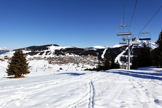 alpine village and chair lift in winter