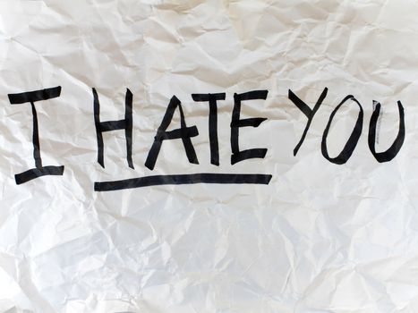 Write I HATE YOU on crumple white paper