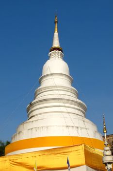 White pagoda with blue sky in Chiang Mai, Thailand