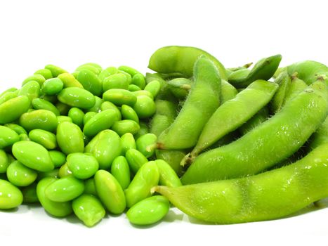 Edamame soy beans shelled and pods on white background