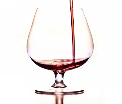 Detail of the wine glass - pouring wine