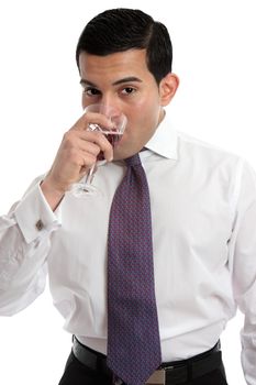 A man tasting or drinking a glass of sparkling red wine made from shiraz grapes.  White background.