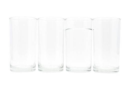 Four glasses with water in one glass on white background