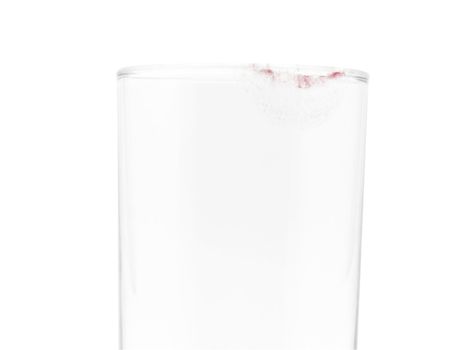 Glass with pink lipstick mark isolated with clipping path