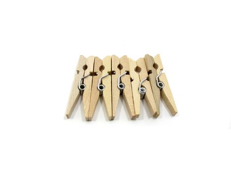 Five wooden pins together on white background