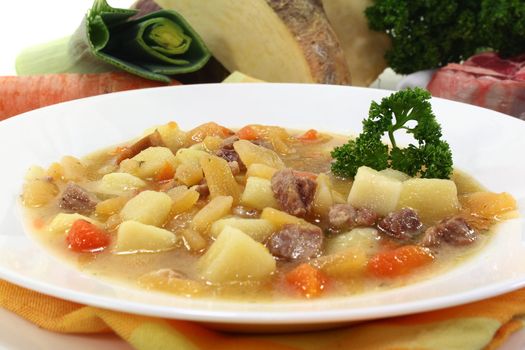 a plate of turnip stew with parsley and cook meat