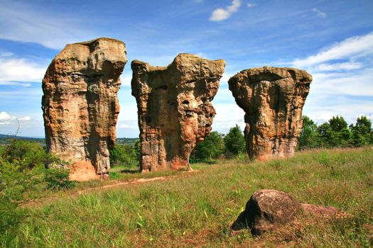 Stonehenge of Thailand, three face rock on the field